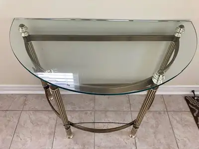 Cresent shaped glass table with gold metal accent legs