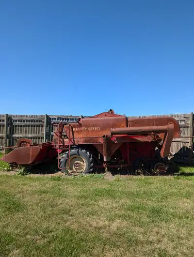 Old Massey Harris 92 Combine. It was great operational when it was shut off. All parts still on it....