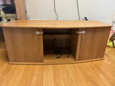 Selling a wood-finish TV stand and a matching small glass display cabinet, both in good, clean condi...
