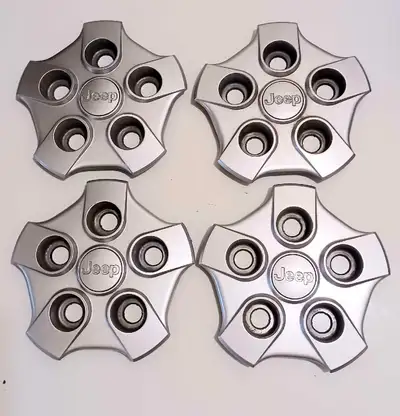 These four genuine Jeep wheel center caps, for Partriot Model Very good condition,clean and fully fu...