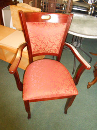 Red and gold upholstered solid wood chair with arms