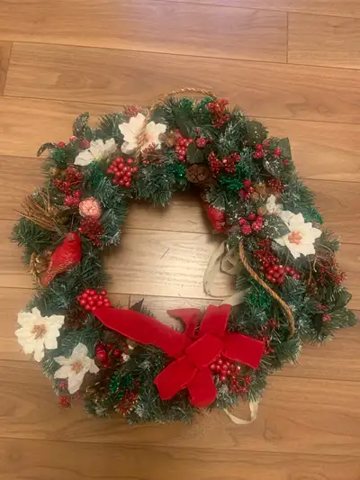 Add a touch of festive charm to your home with this lovely, used Christmas wreath featuring an array...
