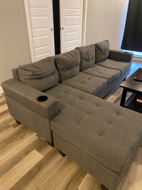 Sectionnal sofa en bon état avec 4 places