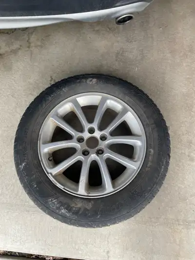 Selling a single 2011 Ford Edge wheel with a Goodyear Winter Command tire, size not specified, in us...