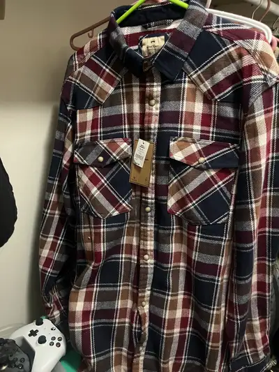 Brand new with tags never worn plaid button down. Buttons are actually snaps Wind river/ Marks brand...