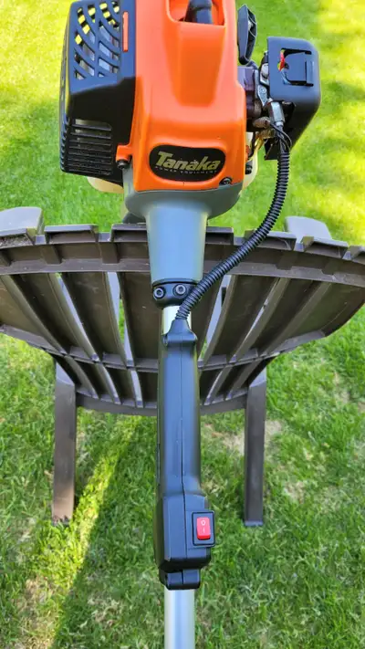 Tanaka grass trimmer, straight shaft, model TCG 22EAS 2 cycle engine, c/w brush cutting options and...