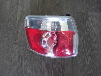 Brand new left tail light for 2007-2012 GMC acadia. Never installed and in the box. $30 obo
