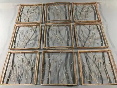 Distinctive 9 piece metal artwork, with overall leaf/branch design appears connected when hung on th...