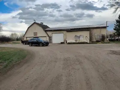2000 square foot barn for rent in De Winton, has electrical on site, 10 foot manual garage door with...