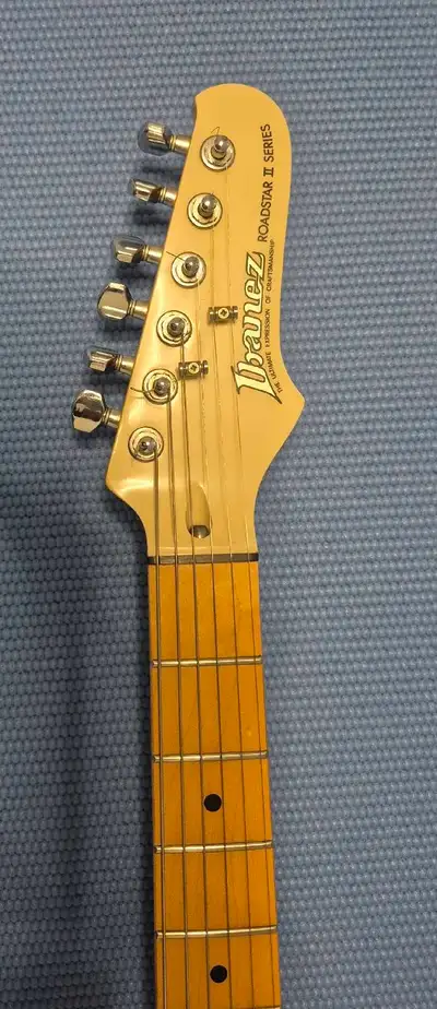 This is a used Ibanez guitar, Roadstar II Series. This guitar plays well and is in good condition. A...
