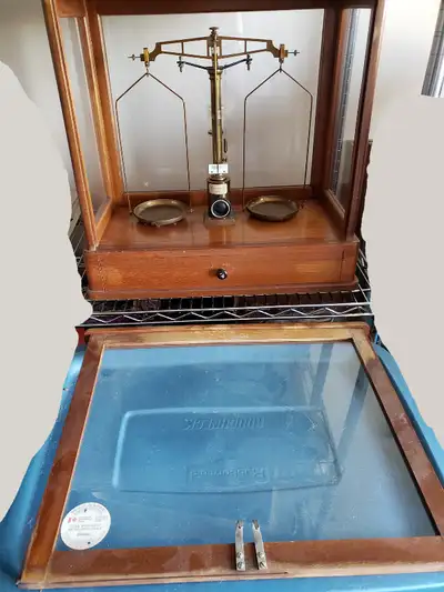 Made in West Germany, this brass scale has a glassed frame and was last certified in 1981. When set...