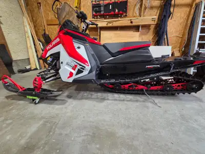 A snow checked sled which means it has unique colors etc.Comes with Polaris cover,oil,extract windsh...