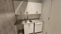 Complete kitchenette with sink and cabinets
