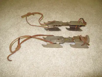 VINTAGE METAL CHILD'S ICE SKATES with leather straps, View more