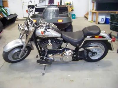 2003 Harley Davidson Fatboy, 100 year Anniversary Edition Fatboy with 7600 miles on it. That's right...