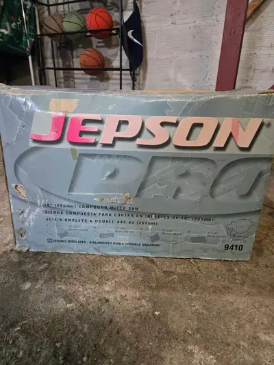 Jepson 9410 compound miter saw. This unit has been stored in the basement but never out of the box....
