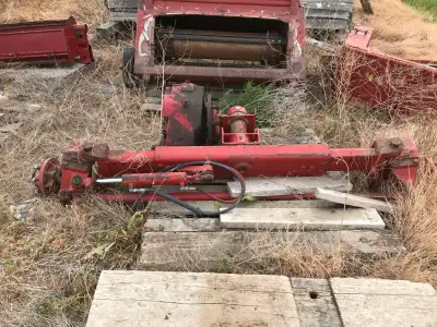 Selection of parts for 1983 /1480 combine reinforce rear axle with tires and rims, PTO and gearbox o...