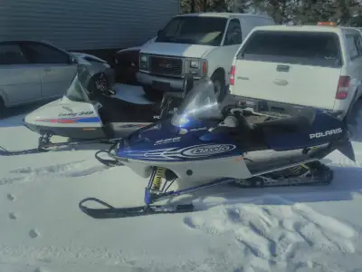 Pair of Polaris snowmobiles. 2002 Classic 600. E/S. Reverse. 99 Indy 340 two up .both sleds are exce...