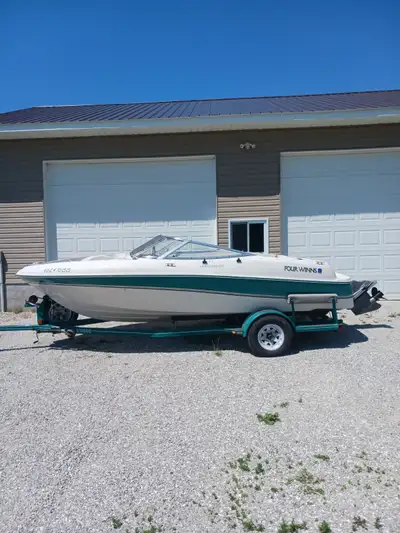 19 ft. Four Winns bow rider boat with custom trailer, mooring cover and camper cover. Powered by V6...