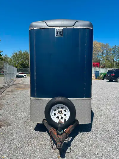 Check out this enclosed trailer, designed to keep your cargo safe and dry on every journey. This use...