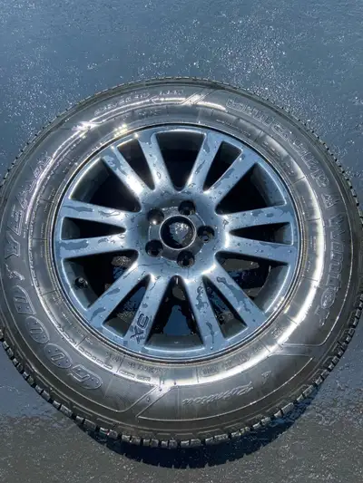 Set of Goodyear Ultragrip studded winter tires. 235/65R 17. Mounted on Volvo XC90 alloy rims. 11/32...