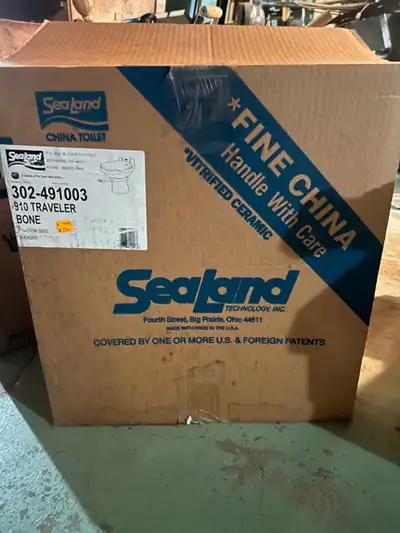 Sealand toilet for motorhome or trailer. New in box. Never used