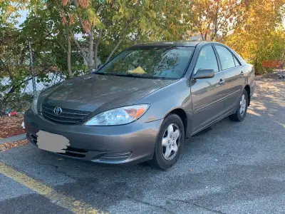 I'm selling my well-used Toyota Camry, a reliable sedan perfect for city commuting or long drives. T...
