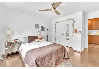 Bright and inviting room available for rent, featuring modern hardwood flooring, ample natural light...