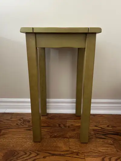 A small green vintage side table in great condition. Extremely sturdy build. Rustic style. Measures...