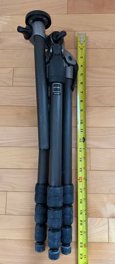 This is a used Gitzo G2258 carbon tripod, known for its lightweight yet sturdy design, making it per...