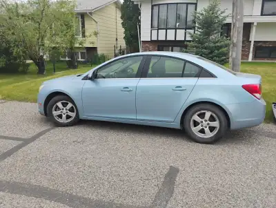 Blue Chevrolet Cruze LT for sale. Has been a super reliable car for the last 6 years we've had it. R...