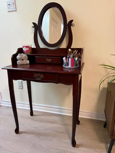 Beautiful cherry solid wood vanity table with an oval swivel mirror, small storage drawer, and class...