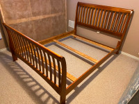 Queen size sleigh bed frame and box spring for sale.