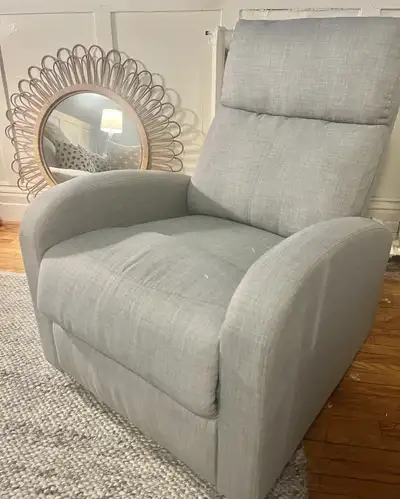 Sink into relaxation with this comfy, used recliner chair, perfect for any living space needing a to...