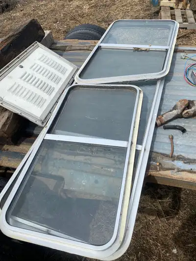 Couple random RV things. 2 sinks. Couple windows. Stove/oven. Battery compartment vented door. What...