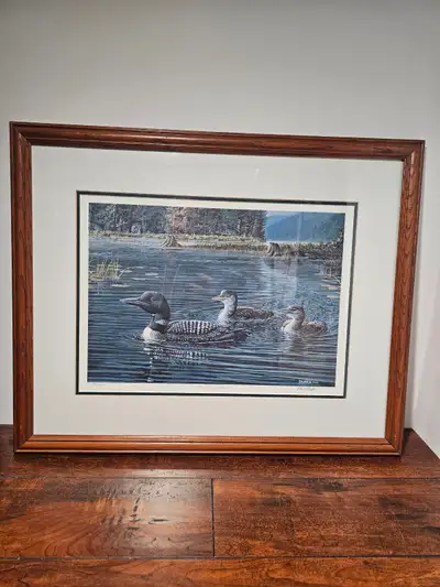 Paul Rankin's 'Heading Home' is a signed and numbered print featuring a serene lake scene with loons...