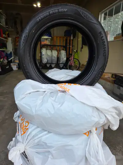For sale: set of 4 Kumho all-season tires. Details: • Brand: Kumho • Size: 215/55R18 • Load/Speed ra...