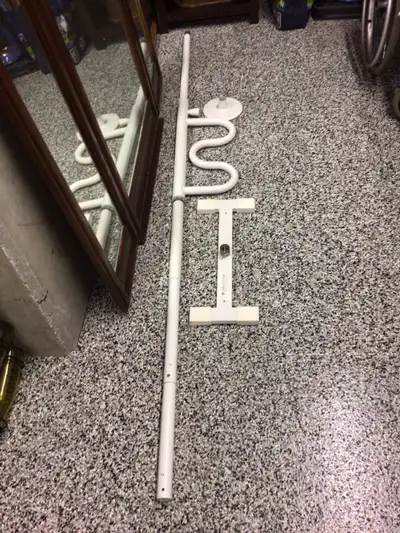 Floor to ceiling security pole, with curved grab bar that pivots and locks position. Tension mounted...