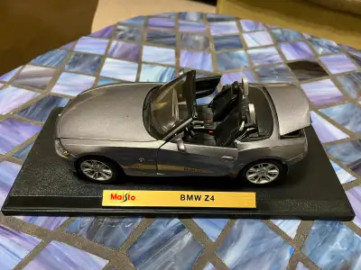 DieCast BMW Z4 - Maisto I believe the scale is: 1/18 Material: Alloy/Plastic I live in Sherwood Park...