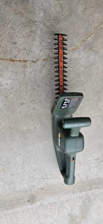 I am selling a used Black and Decker hedge trimmer with a 16-inch blade, perfect for smaller yard ma...