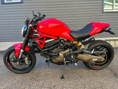 This Ducati Monster 821 is a powerful and stylish street bike, featuring a classic red finish, and e...