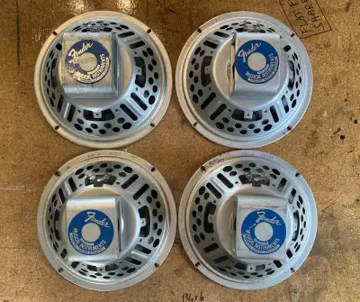 Here's something you don't see everyday. Four original Fender branded Eminence 10 inch alnico magnet...