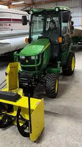 Looking to find someone familiar with John Deere tractors who can detach the snowblower and attach t...