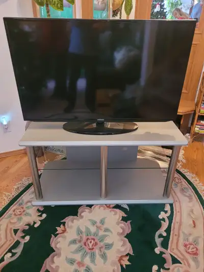 Metal & composite, glass shelf, very strong, built to last. Will hold large T.V. , DVD player, stere...