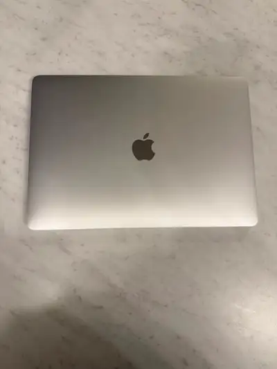 Selling my 2019 MacBook Pro with a 14-inch Retina display. The laptop is in mint overall condition a...