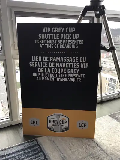 Bilingual 108th CFL football Grey Cup Hamilton VIP shuttle pick up poster. Tiger Cats fan? Mounted o...