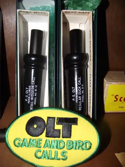 Two Vintage P.S. Olt Duck Calls with a rare Olt Crest & extras, View more