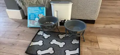 Free to a good home or pet shelter. 2 dog bowls, placemat food container and puppy training pads .
