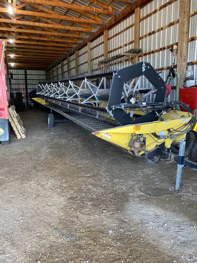 2004 honeybee 36’, cnh adapter, always shedded Good shape comes with new spare rollers and various p...