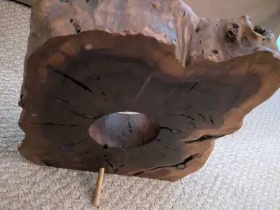 This unique live edge wooden display stand features a beautiful natural grain and an organic, rustic...